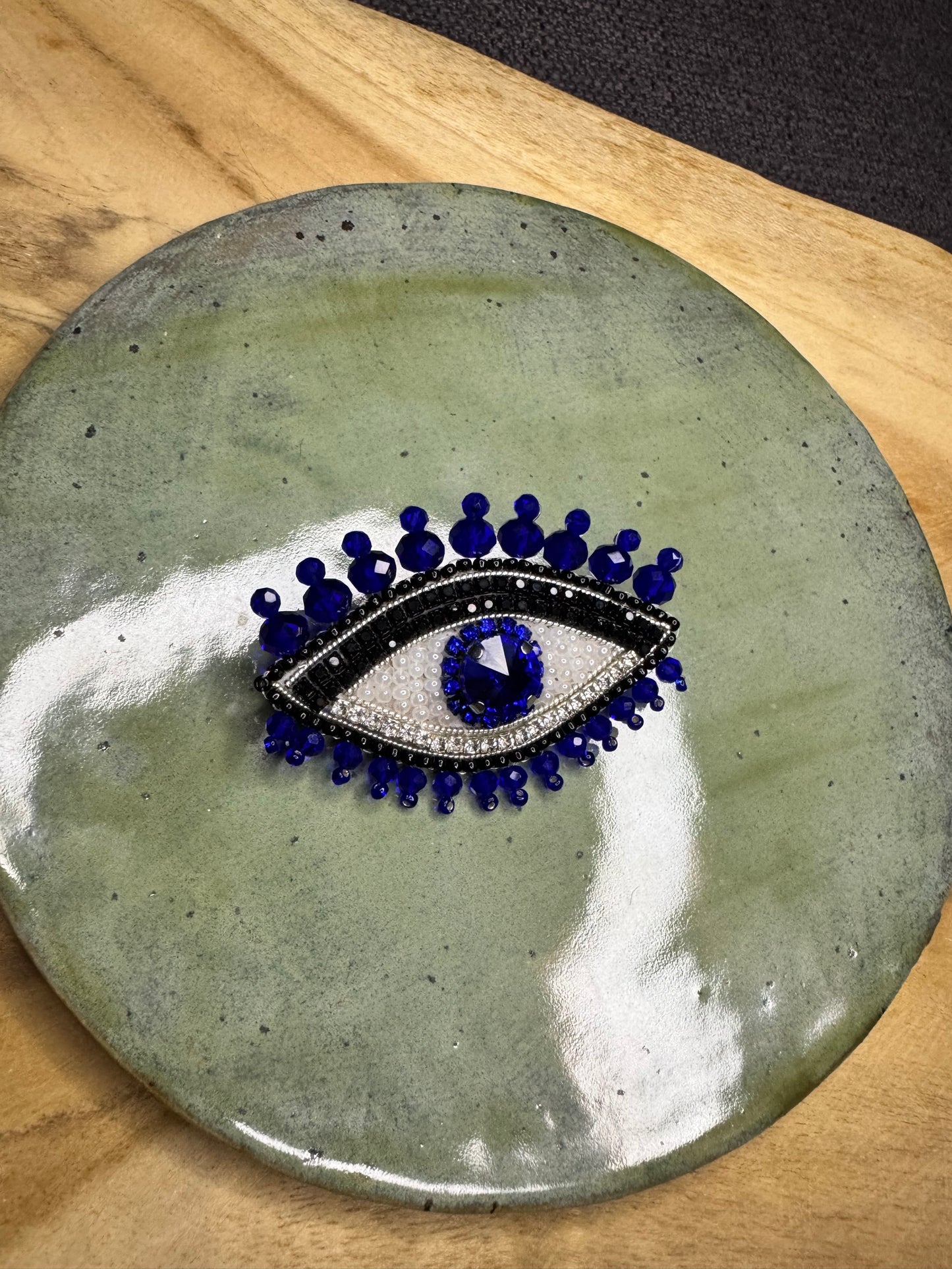 Eye brooches