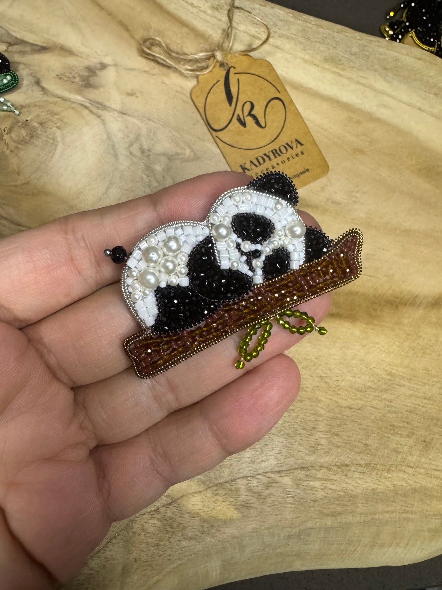 Sleeping panda brooch