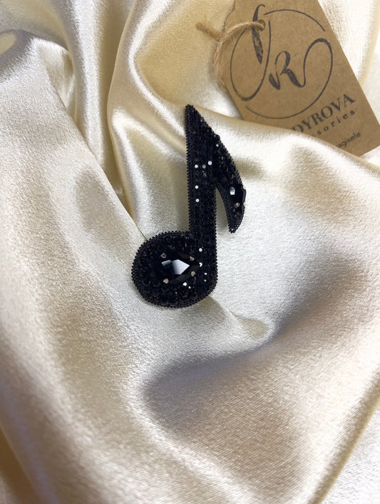 Musical note brooch