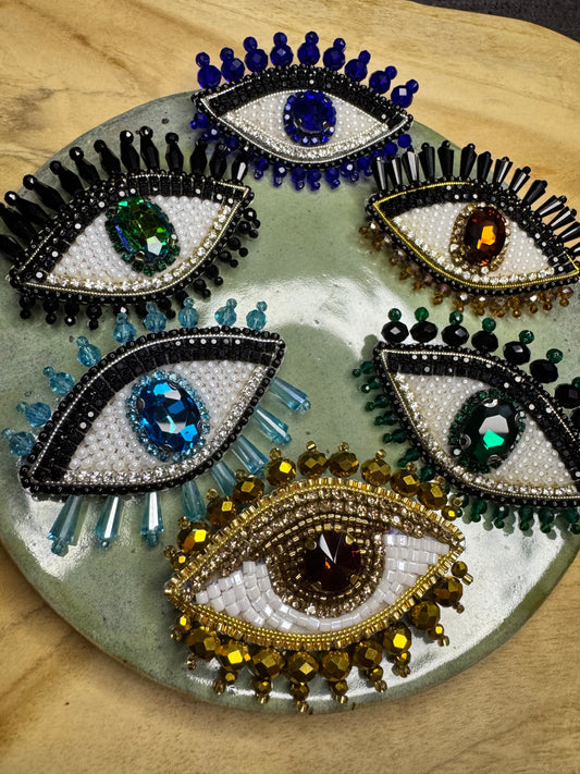 Eye brooches