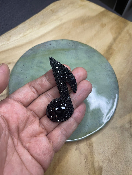 Musical note brooch