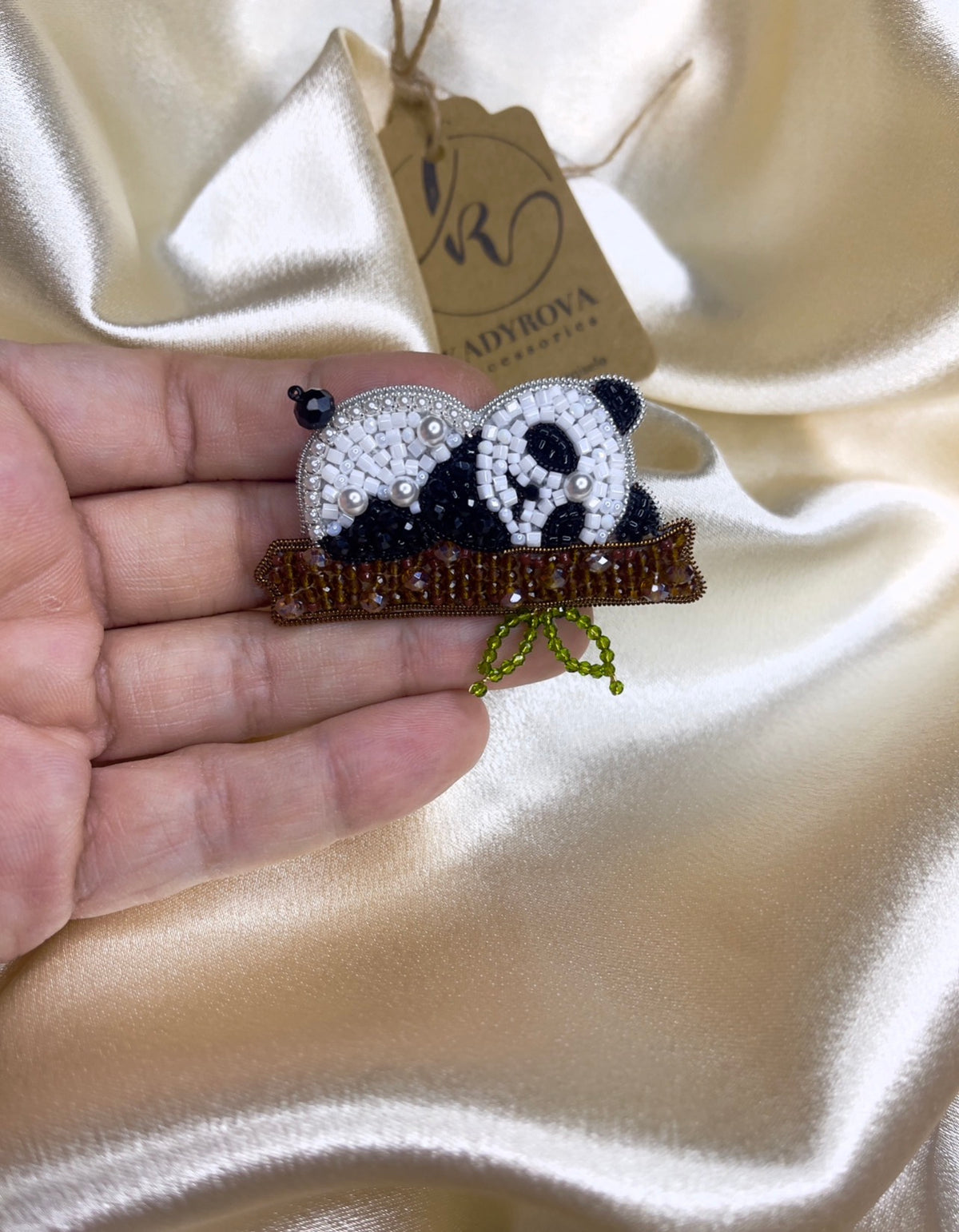 Sleeping panda brooch