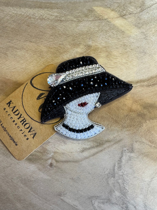 Brooch Lady in a black hat
